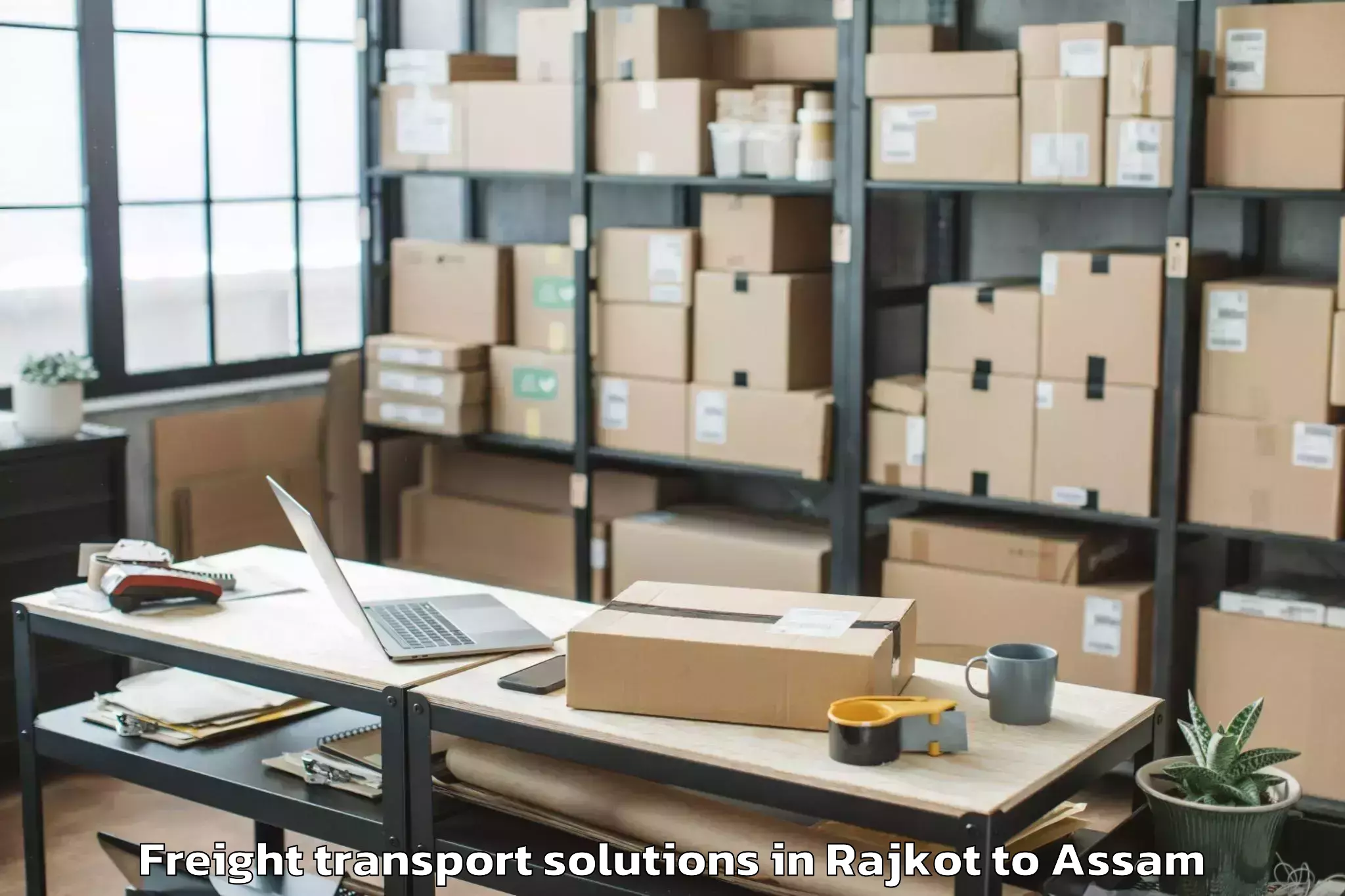 Easy Rajkot to Bokajan Freight Transport Solutions Booking